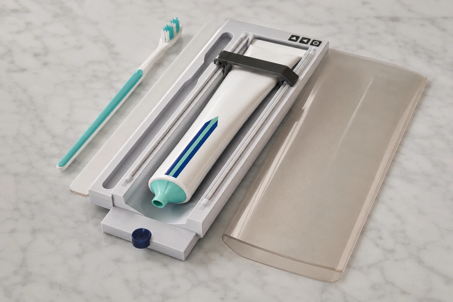 The Pearl case open, showing a toothbrush and toothpaste tube side by side with the one-touch roller that presses out a perfect dab